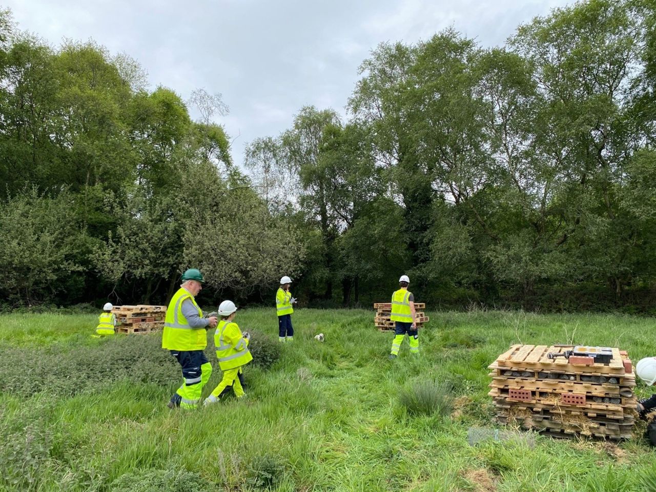 Community members and staff building bee hotels