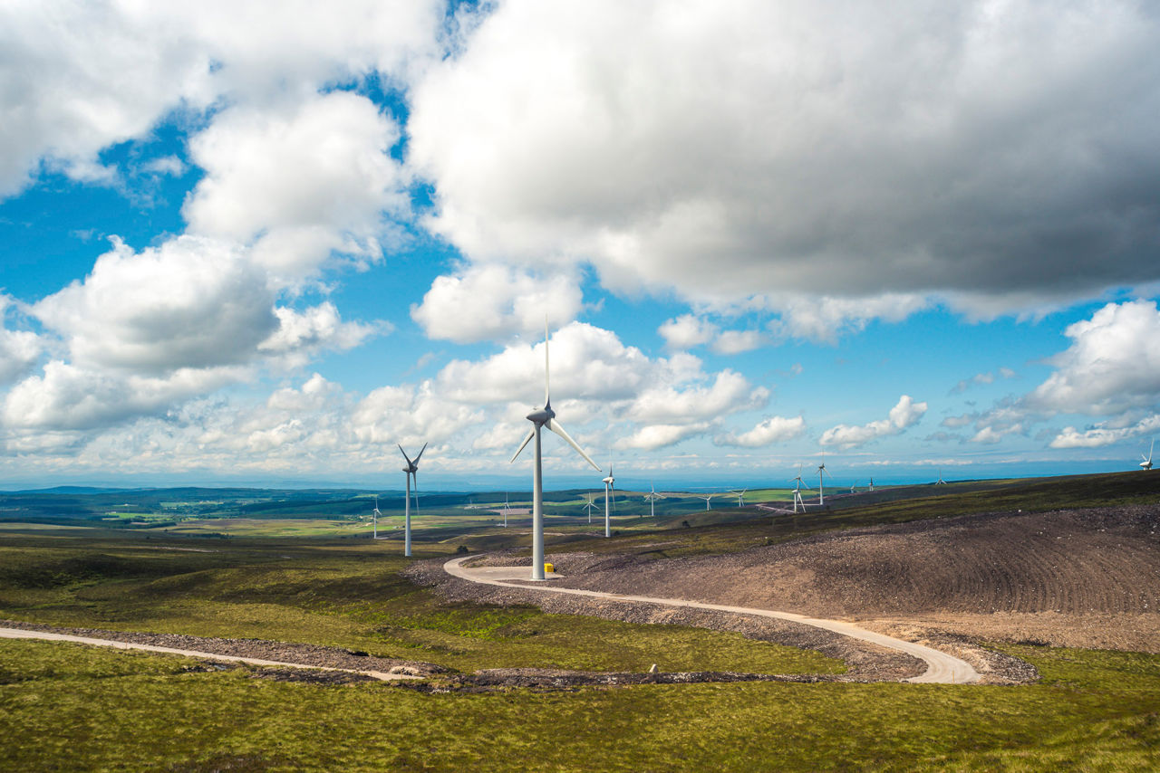 Berrybun wind farm with blue skies and clouds