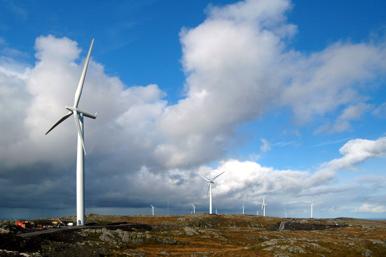 Wind turbines with blue skies and some clouds