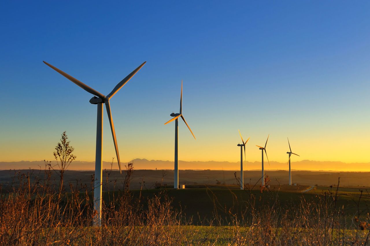 Wind turbines during a sunset