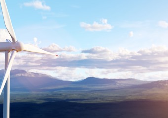 Wind turbine in front of a sunset